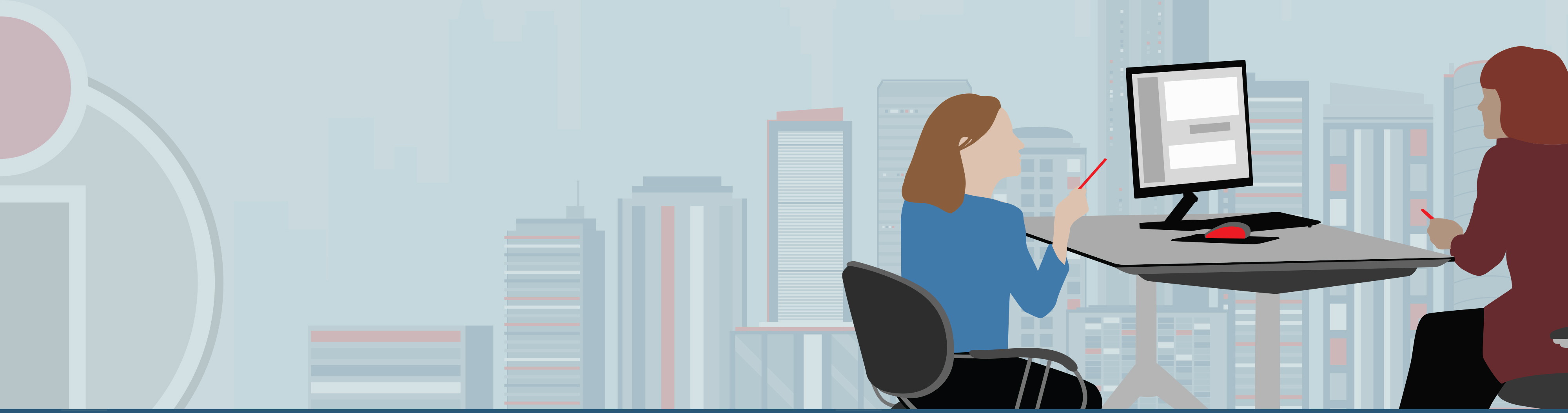 two people at desks viewing screen